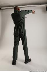 ERIC STANDING POSE WITH GUNS